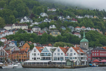 Old hansaetic wooden houses built in row at wharf of Bergen fjord are UNESCO World Heritage site and very popular for turistsのeditorial素材