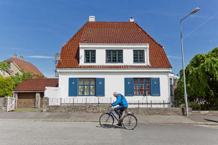 STAVANGER, NORWAY - JUNE 01, 2017: People walking through traditional streets of Stavanger in Norway, which is one of most famous cruise travel destinations in Europe.のeditorial素材