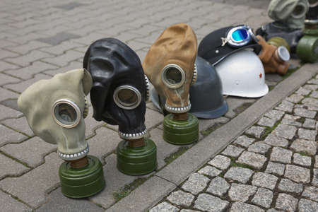 Berlin, Germany April - 18, 2017: Gas masks of second world war displayed on street for tourists as souvenirのeditorial素材