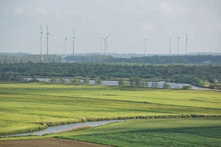 Beautiful countryside landscape with fields and windmills near Kiel - Schleswig-Holstein - Germany.