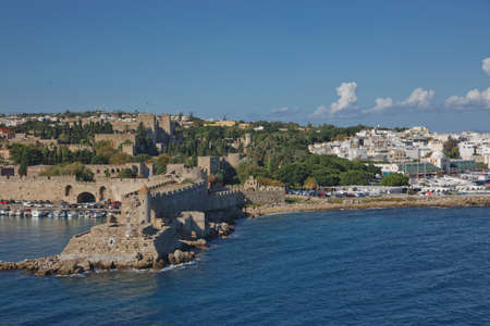 RHODES, GREECE - OCTOBER 26, 2017: Marine Gate and the fortifications of the Old Town of Rhodes, view from Mandraki harbour, Rhodes, Greeceのeditorial素材