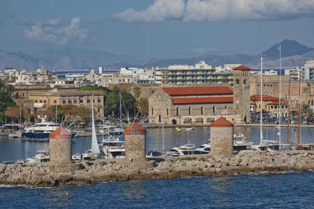 RHODES, GREECE - OCTOBER 26, 2017: Marine Gate and the fortifications of the Old Town of Rhodes, view from Mandraki harbour, Rhodes, Greeceのeditorial素材