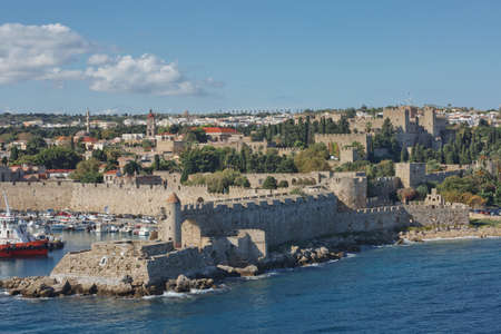 RHODES, GREECE - OCTOBER 26, 2017: Marine Gate and the fortifications of the Old Town of Rhodes, view from Mandraki harbour, Rhodes, Greeceのeditorial素材