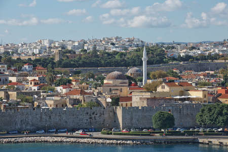 RHODES, GREECE - OCTOBER 26, 2017: Marine Gate and the fortifications of the Old Town of Rhodes, view from Mandraki harbour, Rhodes, Greeceのeditorial素材