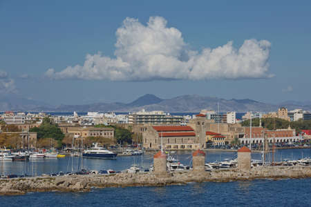 RHODES, GREECE - OCTOBER 26, 2017: Marine Gate and the fortifications of the Old Town of Rhodes, view from Mandraki harbour, Rhodes, Greeceのeditorial素材