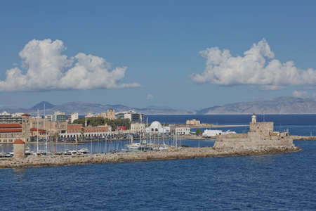 RHODES, GREECE - OCTOBER 26, 2017: Marine Gate and the fortifications of the Old Town of Rhodes, view from Mandraki harbour, Rhodes, Greeceのeditorial素材