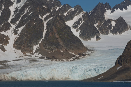 The coastline and mountains of Liefdefjord in the Svalbard Islands (Spitzbergen) in the high Arctic.の写真素材