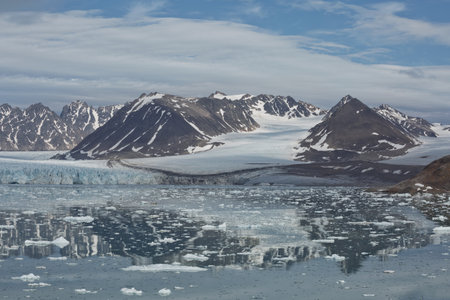 Mountains, glaciers and coastline landscape close to a village called "Ny-Ãlesund" located at 79 degree North on Spitsbergen.の写真素材