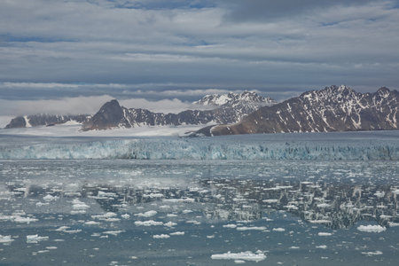 Mountains, glaciers and coastline landscape close to a village called "Ny-Ãlesund" located at 79 degree North on Spitsbergen.の写真素材