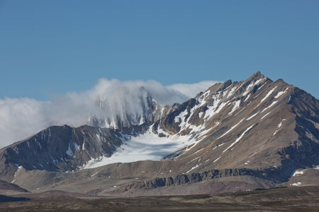 Mountains, glaciers and coastline landscape close to a village called "Ny-Ãlesund" located at 79 degree North on Spitsbergen.の写真素材