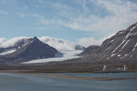 Mountains, glaciers and coastline landscape close to a village called "Ny-Ãlesund" located at 79 degree North on Spitsbergen.の写真素材