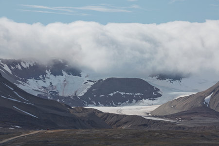 Mountains, glaciers and coastline landscape close to a village called "Ny-Ãlesund" located at 79 degree North on Spitsbergen.の写真素材