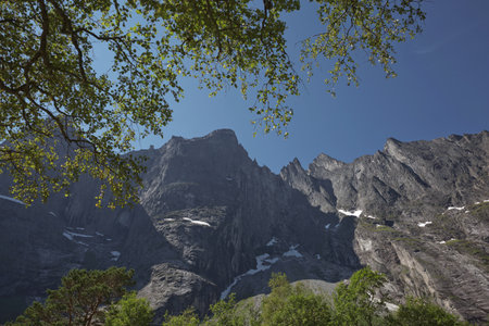 Famous tourist spot The Troll Wall (Trollveggen) - a section of the Trolltinden massif, located on the west coast of Norway in the Romsdalen Valley, Reinheim National Park.の写真素材