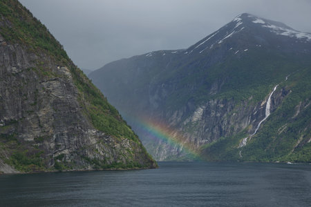 Beautiful rainbow over Geirangerfjord, located near the Geiranger village, Norway.の写真素材