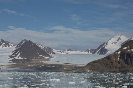 Mountains, glaciers and coastline landscape close to a village called "Ny-Ãlesund" located at 79 degree North on Spitsbergen.の写真素材