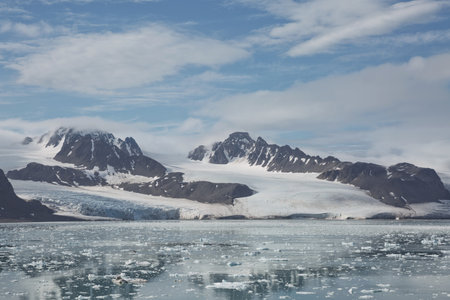 Mountains, glaciers and coastline landscape close to a village called "Ny-Ãlesund" located at 79 degree North on Spitsbergen.の写真素材