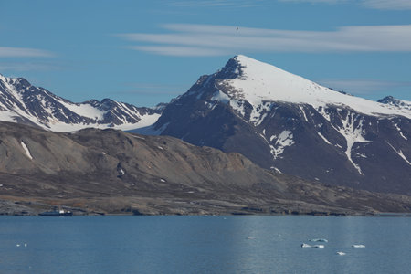 Mountains, glaciers and coastline landscape close to a village called "Ny-Ãlesund" located at 79 degree North on Spitsbergen.の写真素材