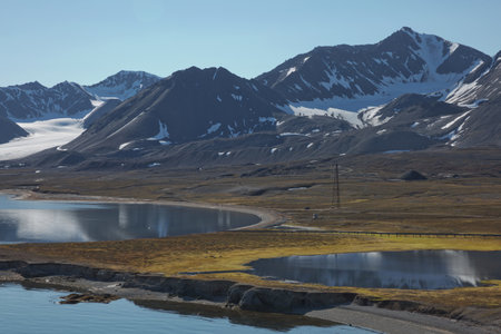Mountains, glaciers and coastline landscape close to a village called "Ny-Ãlesund" located at 79 degree North on Spitsbergen.の写真素材