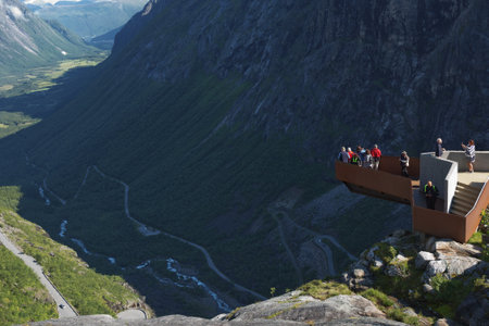 Trollstigen, Norway - July 19, 2017: People enjoying view from Trollstigen viewing or viewpoint platform. Trollstigen or Trolls Path is a serpentine mountain road in Norway.のeditorial素材
