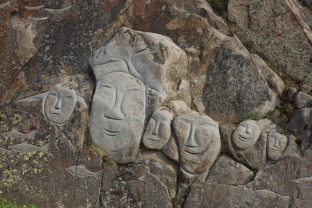 Images of faces chiseled into rocks, Qaqortoq Greenland.の写真素材