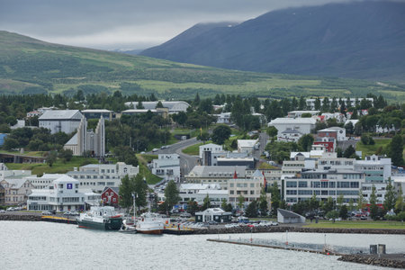 Akureyri, Iceland - July 27, 2017: View of a city center and Akureyrarkirkja church in Akureyri in Iceland.のeditorial素材