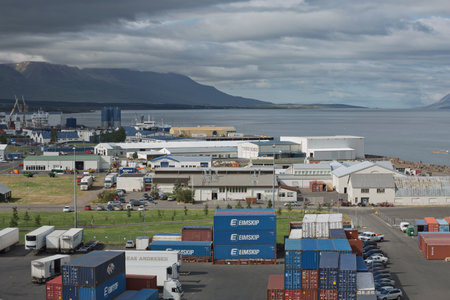 Akureyri, Iceland - July 27, 2017: Trucks and containers ready for transportation at port of...