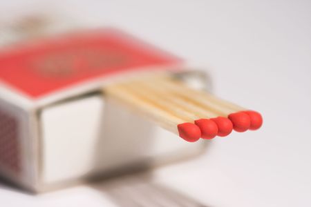 red matches in a matchboxの写真素材