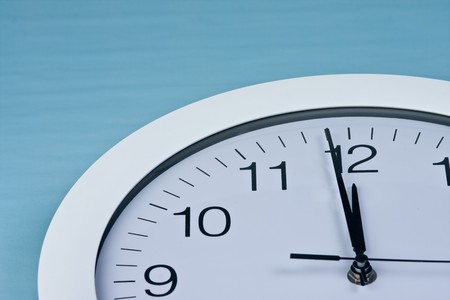 clock and money on blue backgroundの写真素材