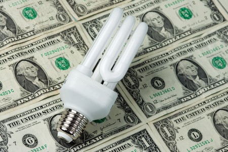 lighting bulb with a money on background
