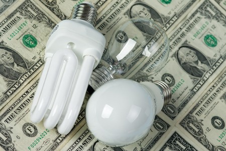 lighting bulbs with a money on background