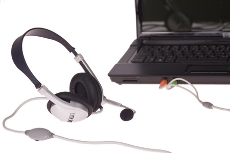 black laptop with headset on white background