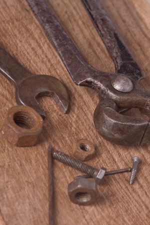 old rusty tools on woody tableの写真素材