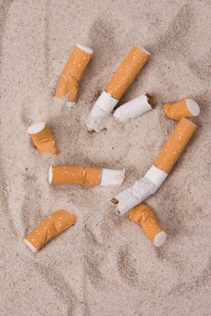 cigarettes in sand