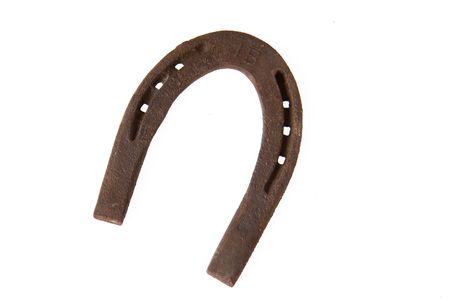 rusty horseshoe on white backgroundの写真素材
