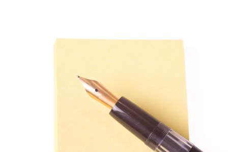 fountain pen and notepaper on white backgroundの写真素材