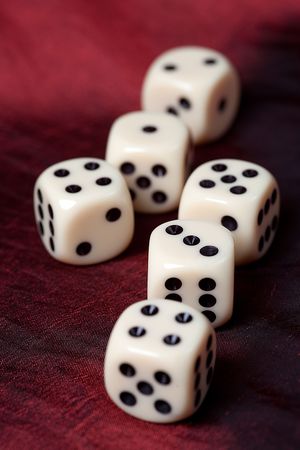 the dice on red fabric