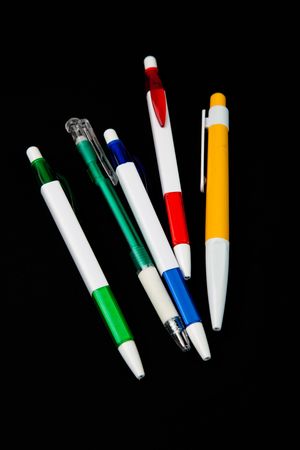 colored pens on black backgroundの写真素材