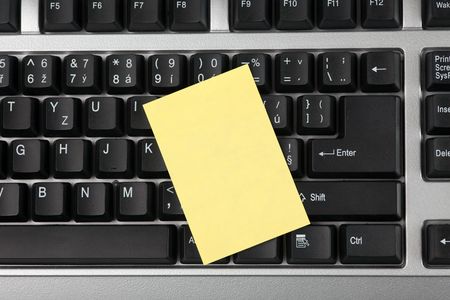 the blank note paper on black keyboardの写真素材