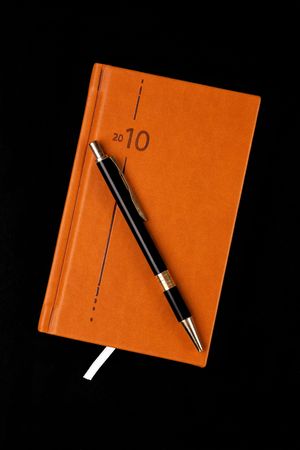 the brown diary and penの写真素材
