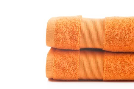 orange towels on white backgroundの写真素材