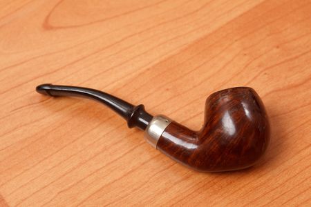 smoking ppipe on wooden backgroundの写真素材