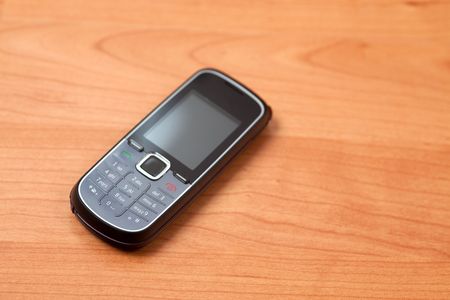 mobile phone on wooden backgroundの写真素材