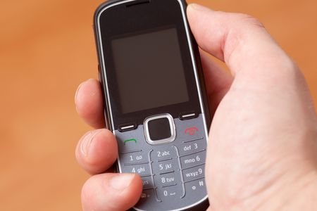 the modern mobile phone in handの写真素材