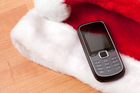 mobile phone on red capの写真素材