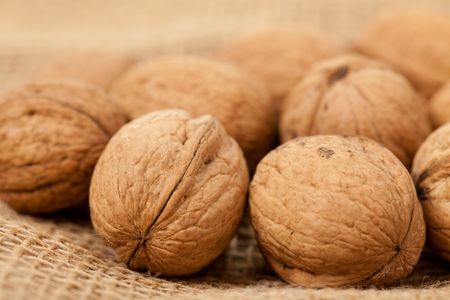 the walnuts laying on juteの写真素材