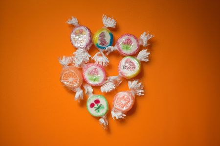 photo shot of colorful candies on color backgroundの写真素材