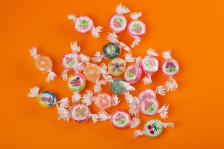 photo shot of colorful candies on color backgroundの写真素材