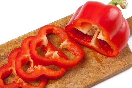 photo shot of cutting red pepper on woodの写真素材