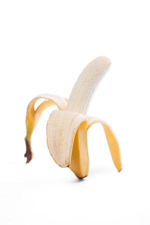 photo shot of peeled fresh banana on white backgroundの写真素材