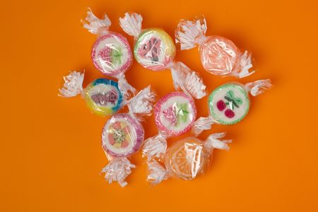 photo shot of colorful candies on color backgroundの写真素材